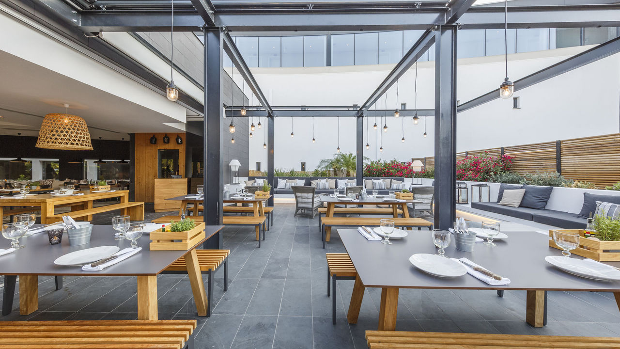 Dining on the outdoor terrace at Praia Verde Boutique Hotel. Castro Marim, Algarve, Portugal