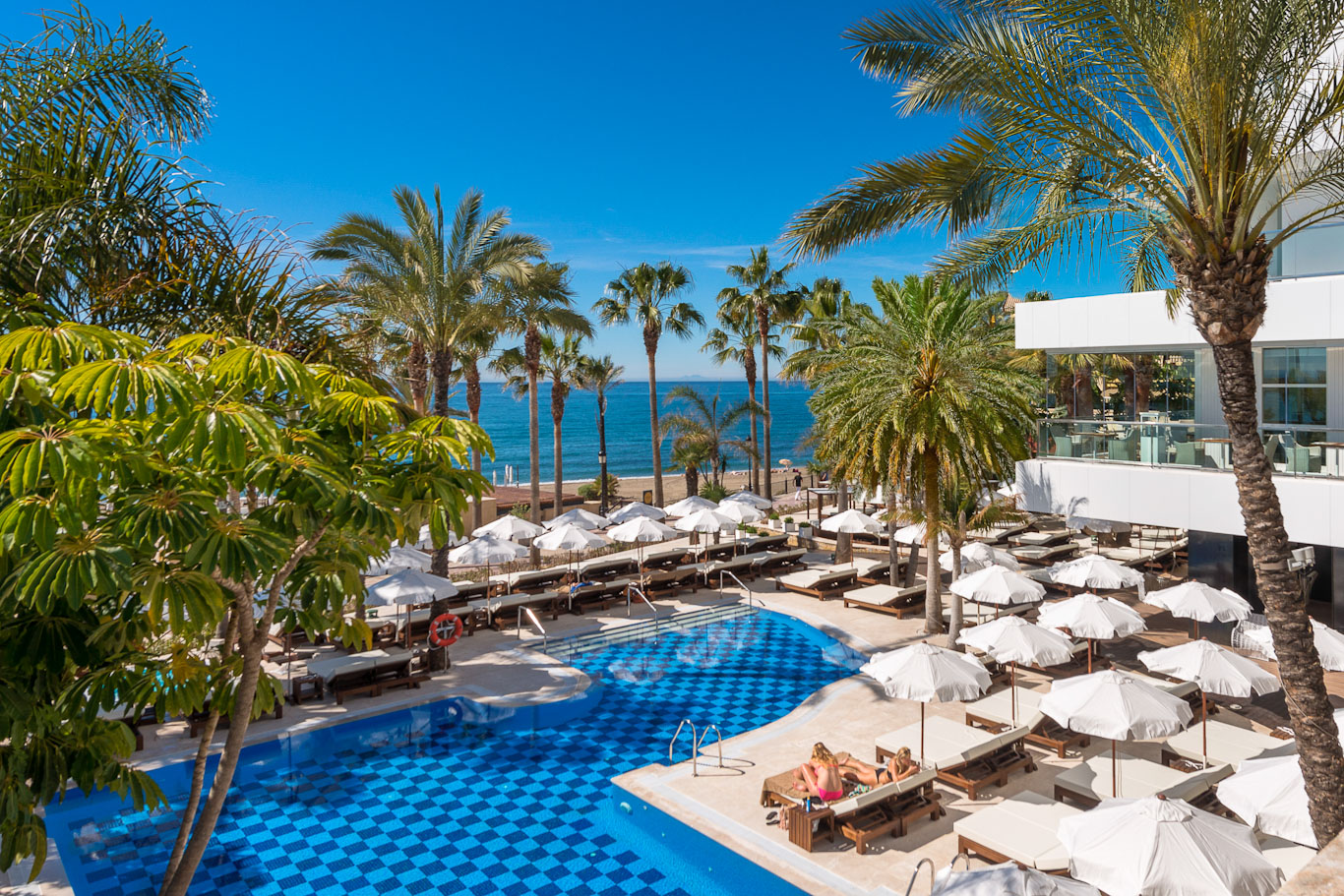 Sunshades for everyone by the pool at the Amare Beach Hotel Marbella, Costa del Sol, Spain