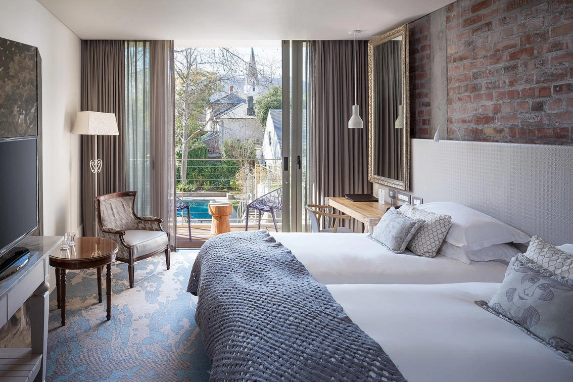 A stylish bedroom at Oude Werf, Stellenbosch, South Africa. Golf Planet Holidays.