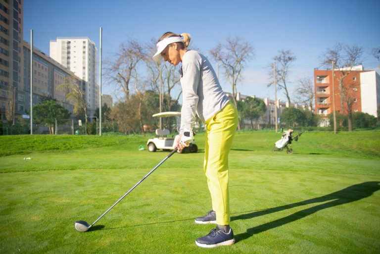 Woman golfer getting ready to play golf. Golf Planet Holidays