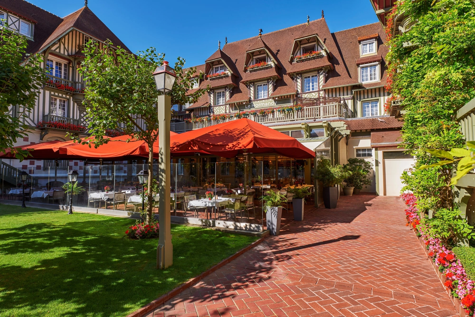 On the terrace at Normandy Barriere Hotel, Deauville, France. Golf Planet Holidays.