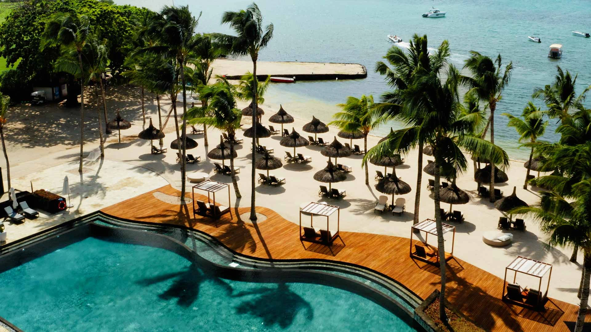Relax by the beach at Anahita Golf and Spa Resort, Mauritus. Golf Planet Holidays.